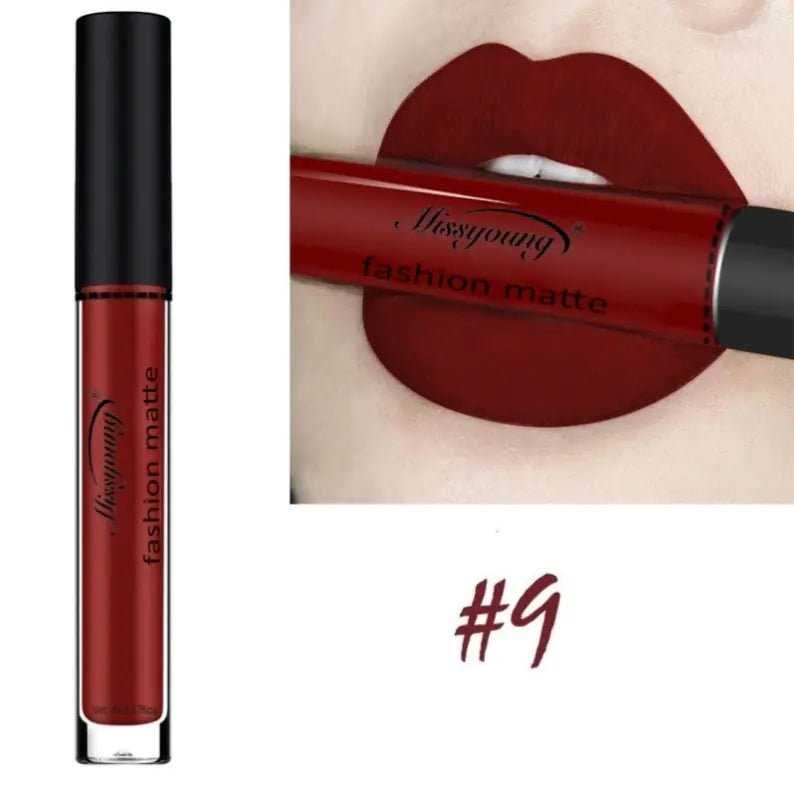 On the left is a tube of Léa Beauty & Cosmetics Non-Stick Matte Liquid Lipstick Lip Gloss Makeup in shade #9. The right shows lips with its dark red, matte, long-lasting, and moisturizing formula, holding the tube between the lips.