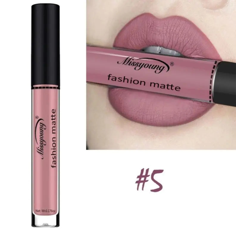 A tube of Léa Beauty & Cosmetics Non-Stick Matte Liquid Lipstick Lip Gloss Makeup in shade #5 is displayed next to lips wearing the same mauve-pink matte color, with the product held stylishly between the lips.