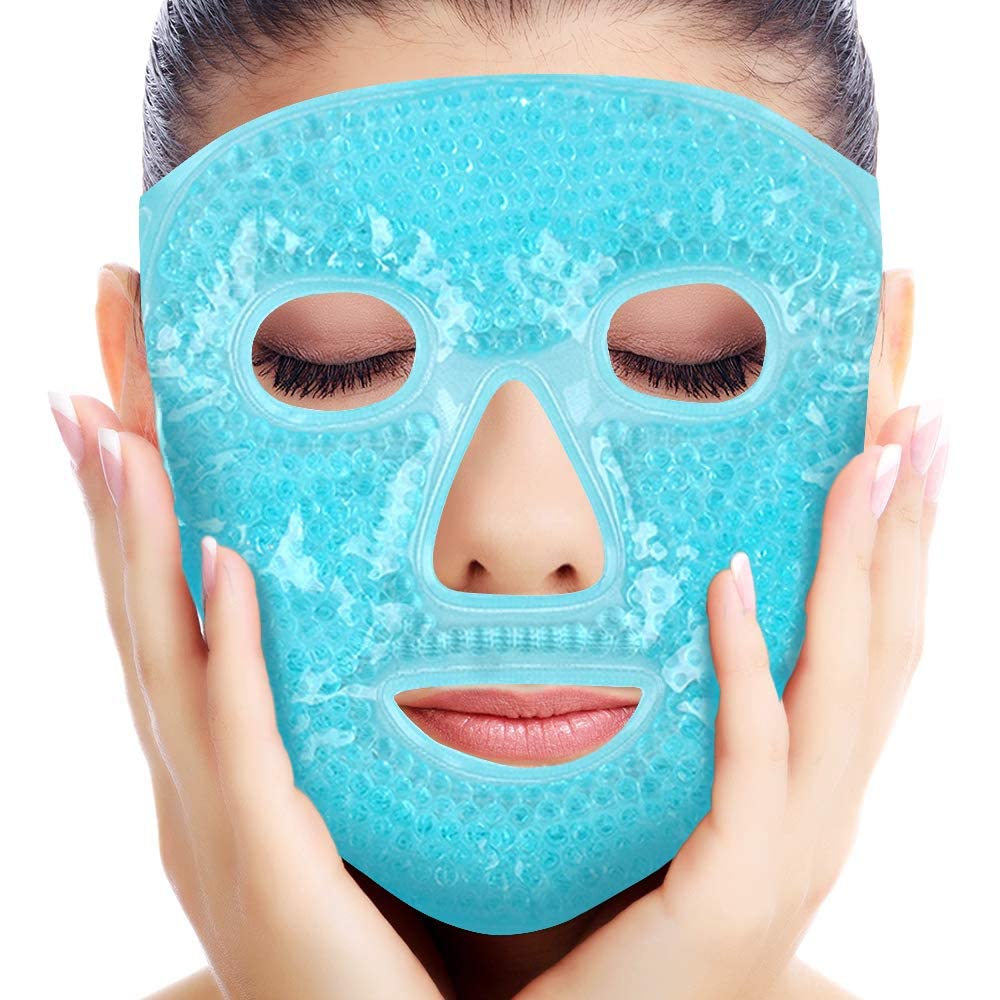 A person with closed eyes holds their face while wearing the Masque froid pour lacné by My Store, a blue gel bead mask that covers the full face with cutouts for eyes, nose, and mouth, known for its anti-inflammatory properties.