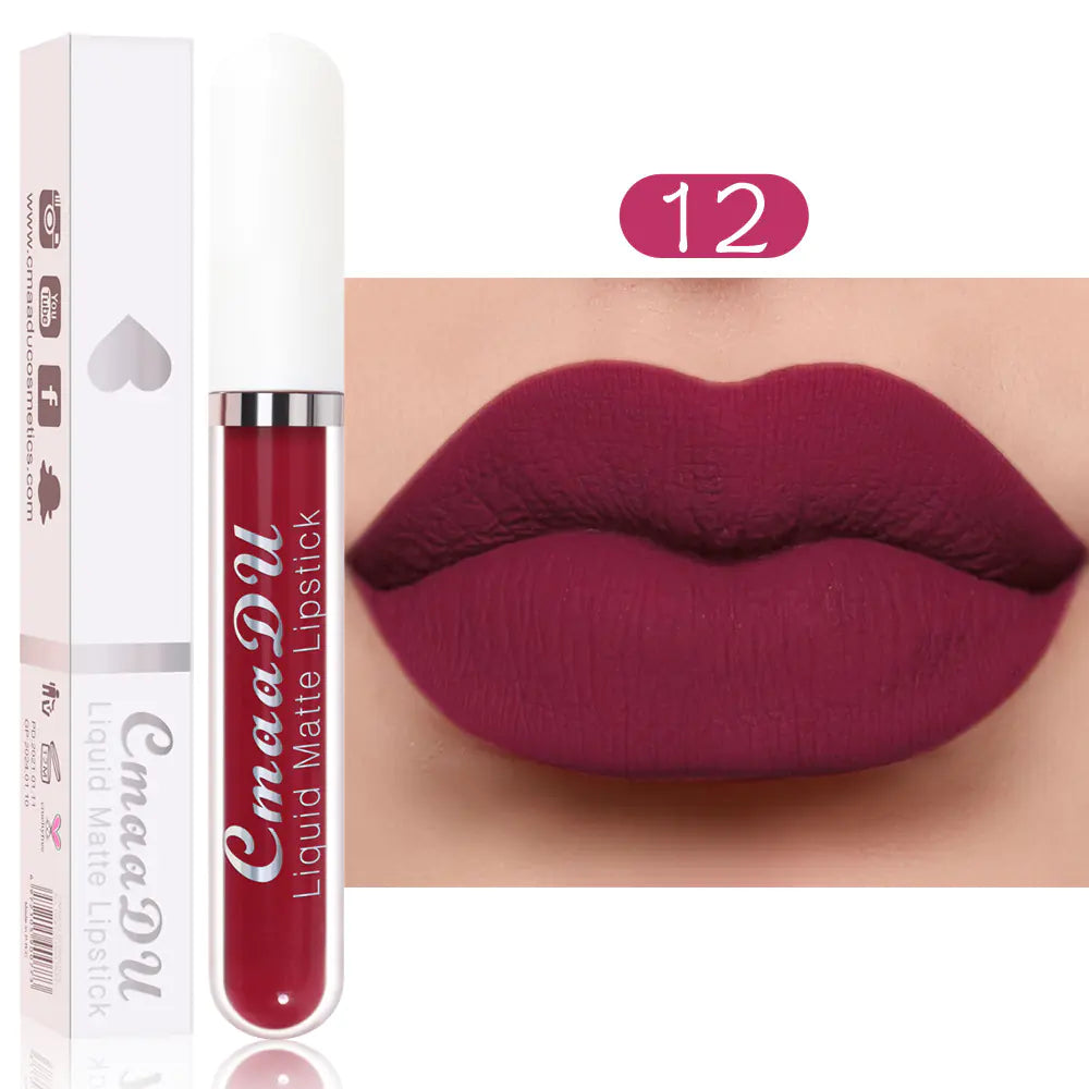 Léa Beauty & Cosmetics Matte Non-Stick Waterproof Long-Lasting Lip Gloss in shade 12 is shown next to its packaging and on lips, featuring a bold matte berry-red color with long-lasting, waterproof wear for any occasion.