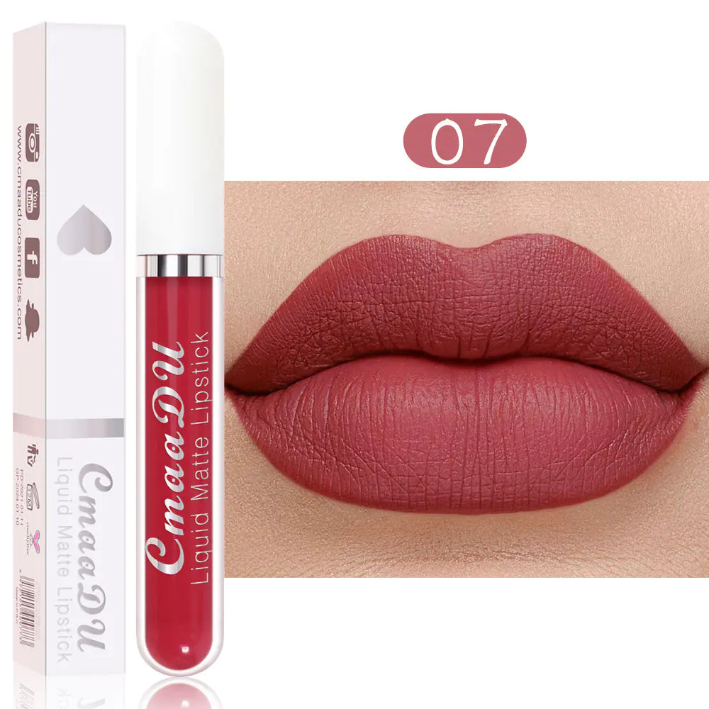 A tube of Léa Beauty & Cosmetics Matte Non-Stick Waterproof Long-Lasting Lip Gloss is displayed with its packaging, beside lips wearing the bold rose-red shade, showing its matte finish and durable, waterproof performance.